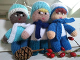 Three knitted nystagmus mascots wearing woolly hats and scarves.